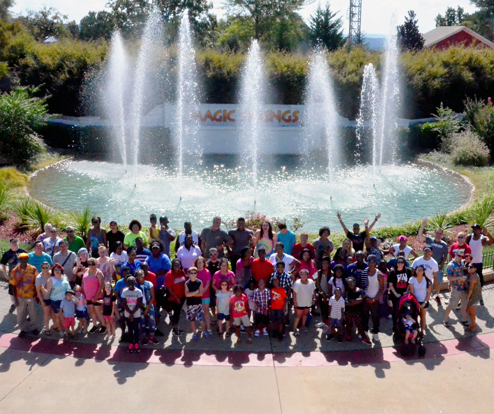corporate-event-group-at-fountain Group enjoying a corporate event posing in front of fountain