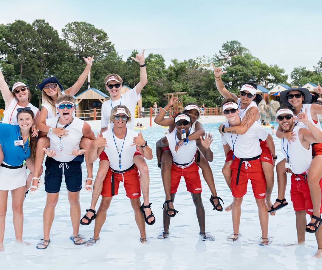 lifeguard-group-at-pool Group of lifeguards at wave pool
